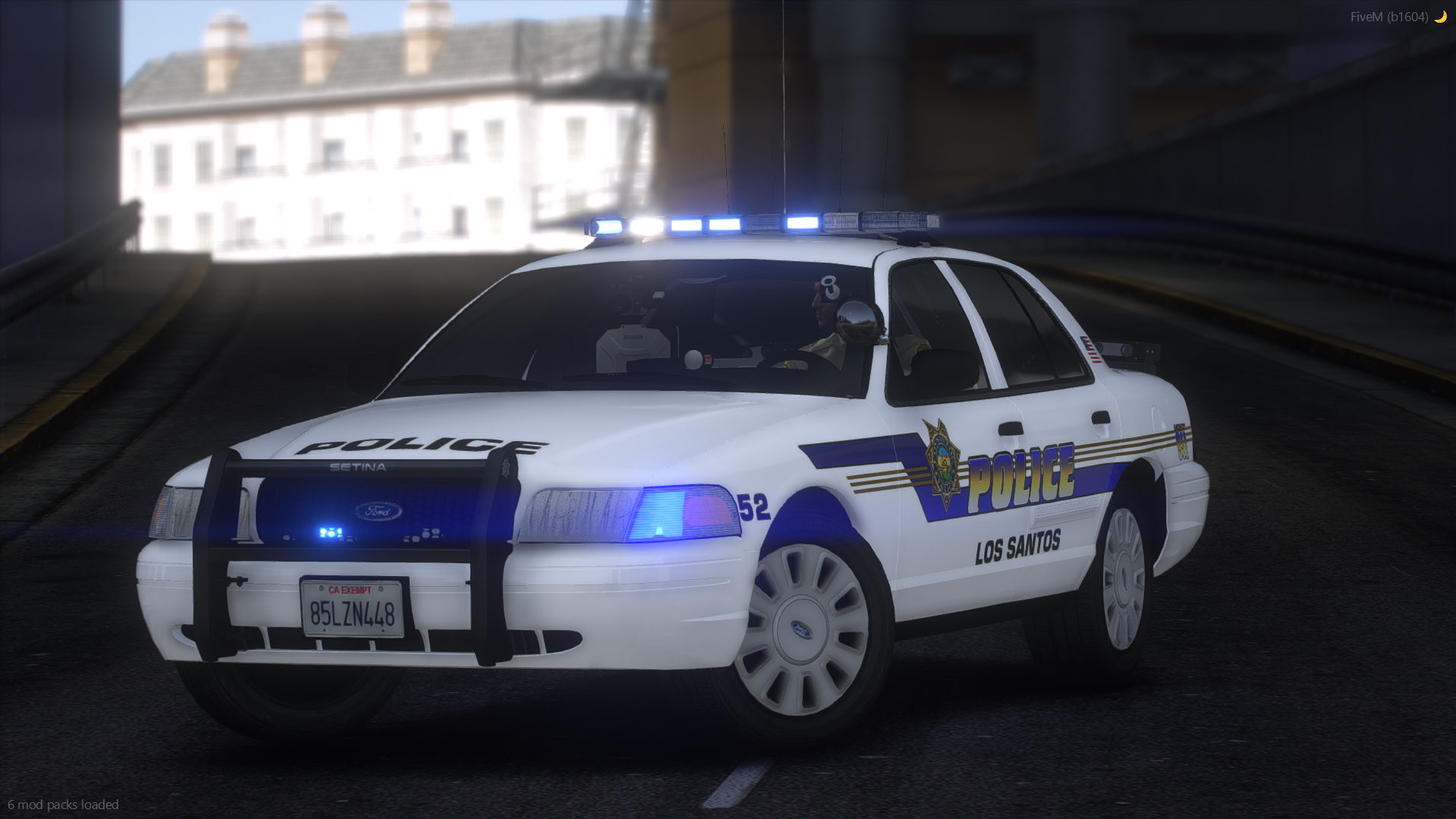 A Crown Victoria police car with a Whelen Patriot lightbar, featuring NON-ELS technology